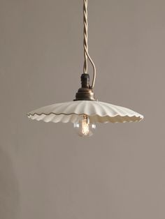 an umbrella light hanging from a ceiling