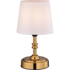 a gold table lamp with a white shade