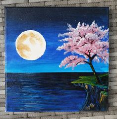 a painting of a tree on a brick wall with a full moon in the background