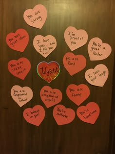 a bunch of paper hearts that say i love you and have some words written on them