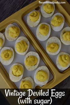 vintage deviled eggs with sugar in an egg tray