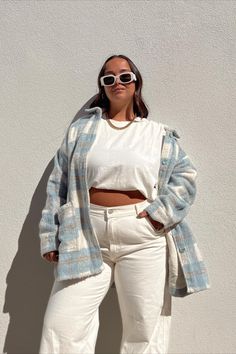 Woman standing against wall. Girl Math, Ice Blue Color, L Space, Ice Blue, Faux Fur, Blue Color, Blue, Color