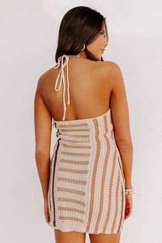 – Soak up the sun in our new stunning dress – Lightweight loose knit material in brown hued stripe pattern and a full soft liner – Flirty high halter tie neckline with an open upper back – Flattering figure hugging silhouette that falls into a straight hemline Measurements S : Bust 28", Hip 32", Length 27", Waist 26". M : Bust 30", Hip 36", Length 27.5", Waist 28". L : Bust 34", Hip 38", Length 28", Waist 30". Striped Halter Neck Top For Vacation, Beige Halter Neck Mini Dress For Day Out, Brown Summer Halter Dress For Beach, Brown Halter Dress For Summer Beach, Summer Beach Brown Halter Dress, Brown Halter Dress For Beach In Summer, Brown Sleeveless Halter Dress For Beach, Brown Halter Top For Beach In Spring, Sleeveless Brown Halter Dress For Beach