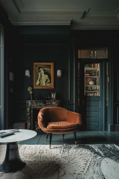 a living room filled with furniture and a painting on the wall