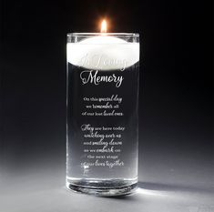 a candle that is inside of a glass with a poem written on the front and side