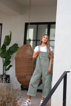 Introducing the Frankie Denim Overalls in Sage. Designed with adjustable straps, an oversized fit, and distressed details, these sage green bib overalls offer both style and comfort. The wide leg pant gives a trendy touch, making them a must-have for any fashion-forward individual. Model Measurements: Hips 40.5” Waist 27.5” Bust: 34”, Height 5’7.5, wearing a size small Material: 100 Cotton Measurements XS: Hips: 42"| Length: 44" (taken from top of front of overalls to ankle cuff) S: Hips: 42"| L Spring Cargo Style Overalls, Trendy Spring Cargo Style Overalls, Casual Cargo Style Denim Jumpsuit, Casual Cotton Cargo Jumpsuits And Rompers, Fall Cargo Style Overalls, Trendy Spring Cargo Style Jumpsuits And Rompers, Trendy Cargo Style Jumpsuits And Rompers For Spring, Fall Casual Cargo Overalls, Casual Cotton Cargo Style Overalls