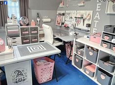 a desk with several bins and shelves on the wall next to it in a room that has blue carpet