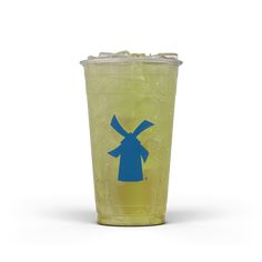 a yellow plastic cup with a blue windmill on the front and bottom, filled with ice