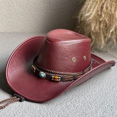 Show off your cowboy style with our Cowgirl Adjustable Faux Leather Western Hat. Made from high-quality faux leather, it features a curved wide brim that protects you from the sun in style. The adjustable drawstring ensures a snug fit. Pair it with a denim jacket and boots for an ultimate western look. Disco cowgirl western hat Faux leather Internal adjustable drawstring Curved wide brim Height: 56cm / 22in Retro Adjustable Hat For Rodeo, Casual Leather Hat Bands For Rodeo, Adjustable Leather Hat For Fall, Adjustable Leather Fall Hats, Trendy Adjustable Leather Hat, Retro Adjustable Hat Band For Rodeo, Leather Hats For Fall Festival, Trendy Brown Hat For Rodeo, Best Cowboy Hats