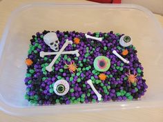 a plastic container filled with halloween decorations