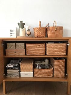 a shelf with baskets and other items on it