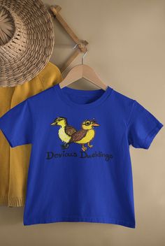 Devious Ducklings - Unisex Short Sleeve Toddler Shirt All Designs Are Homemade And Original Crazy Duck | Gift For Duck Lover | Duck Owner Shirt | Plus Size Duck This is the perfect gift for the crazy duck lovers who is the ultimate animal lover. This duck owner shirt makes a great conversation starter with your family and friends. This gift for duck lovers comes available for the plus-size duck lover in your life. This updated unisex essential fits like a well-loved favorite super-soft cotton, and excellent quality print makes one fall in love with it over and over again. Our shirts are true to size. Our ink is infused into the fibers to give you long wear. .: 100% Airlume combed and ringspun cotton (fiber content may vary for different colors) .: Light fabric (4.2 oz/yd² (142 g/m .: Retai Crazy Duck, Duck Gifts, Great Conversation Starters, The Crazy, Unisex Shorts, Clothing Items, Light Fabric, Animal Lover, Print Quality