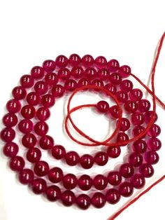 GEMSTONE    - RUBY CORUNDUMSHAPE             - ROUND (SMOOTHSIZE                 -  5.MMLENGTH          -  14 INCH LONG STRANDQUALITY         -  TOPCOLOUR         -  REDBEAUTIFUL RUBY CORUNDUM ROUND BEADS TOTAL 10 STRANDSWHOLESALE SHOPIf you have any questions about this item please contact me I will get back to you as soon as.THANK YOUWe accept bulk or wholesale orders for any gemstone which you'll get best wholesale prices! Hence you can contact me with your requirement of bulk or wholesale or Ruby Beads, Beads Wholesale, Ruby Necklace, Teardrop Beads, Ruby Gemstone, Red Bead, Stunning Necklace, Colour Red, Wholesale Beads