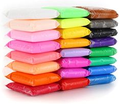 a stack of different colored bags on top of each other in front of a white background