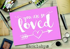 you are so loved card surrounded by supplies like paint, crayons and markers