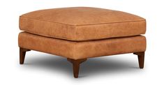 an ottoman with wooden legs and a tan leather cushion on it's back end