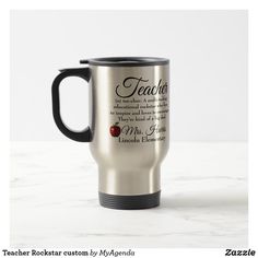 a stainless steel coffee mug with an apple on the bottom and words that read teacher