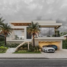 two cars parked in front of a modern house with palm trees and landscaping around it