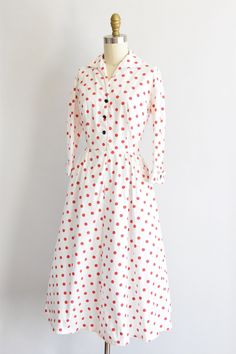 "Vintage 1950s cotton sundress. White with red polka dot print. V collar, darted bust and fold over long sleeves . Faux pockets in back. Nipped waist followed by a full skirt. Front button closure. State of garment | good, light overall wear and faint yellowing underarms, the inner collar and near hemline. Measurements ✂--- best fit | extra small bust | up to 37 \" shoulders | 15 \" shoulder to waist | 14\" sleeves | 16\" waist | 24 - snug 25\" hips | free total length (shoulder to hem) | 42 \" Vintage Polka Dot Long Sleeve Dresses, Vintage Long Sleeve Polka Dot Dress, Polka Dot Long Sleeve Cotton Dress, Long Sleeve Polka Dot Cotton Dress, Collared Polka Dot Dresses With Buttons, Polka Dot Collared Dress With Buttons, Spring Polka Dot Collared Dresses, Vintage Polka Dot Dress With Buttons, Vintage Polka Dot Lined Dresses