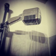 a shower head with water coming out of it