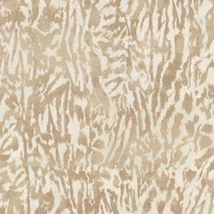 an animal print pattern on fabric in beige and white colors, including zebras or stripes