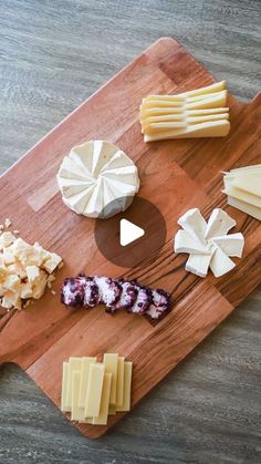 several different types of cheese on a cutting board