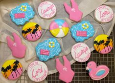 some decorated cookies are sitting on a cooling rack