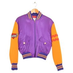 Superb, Colourful Vintage 1990's Moschino 'Cheap & Chic' Varsity jacket, featuring a purple satin body with orange sleeves and 'for your eyes only' embroidered detailing spelled out on the reverse. MADE IN ITALY ! Features: Central line zip fasten Cropped fit Fully lined Two hip pockets Satin body Sizing given in inches: Pit to Pit: 22'' Pit to Cuff: 17.5'' Nape to Hem: 22'' Recommended Size: One Size / UK 6-12 Condition: 9/10 Moschino Jacket, Franco Moschino, Central Line, Moschino Cheap And Chic, For Your Eyes Only, Purple Satin, Chic Vintage, Body Size, Vintage Colors