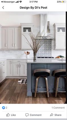 two stools sit at the center of a kitchen island