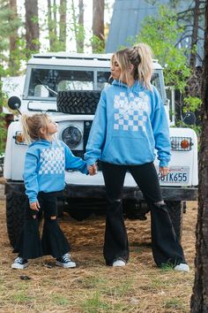 MAMA checkered hoodie in light blue. This trendy MAMA hoodie is super comfortable & pairs perfectly with the kids MINI hoodie for cool matching family outfits! Shop the full Krista Horton x Slyfox collection for more trendy mom sweatshirts, matching family sweatshirts & everything you need to achieve the ultimate cool mom aesthetic.