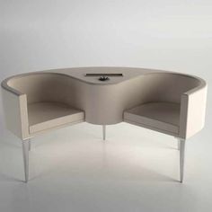 an oval shaped table with two chairs on it