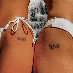 two women with butterfly tattoos on their butts