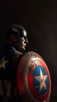 a man dressed as captain america holding a shield in his right hand and looking off into the distance