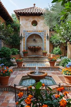 an outdoor fountain surrounded by potted plants