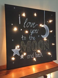 i love you to the moon and back light up sign with lights on it's side