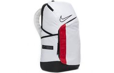 a white backpack with black and red details on the front, sitting against a white background