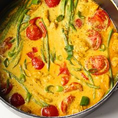 a pan filled with food on top of a stove