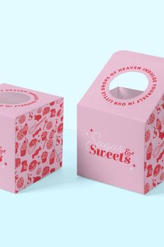 two pink boxes with hearts on them sitting next to each other