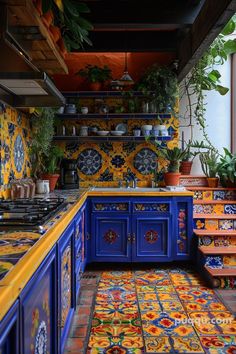 a kitchen with blue cabinets and colorful tiles on the counter tops, along with potted plants