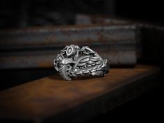 Motorcycle with biker pinky men ring in sterling silver, Daintily silver biker men ring, Small gothic style gift men ring, Biker men jewelry Biker rings are an indispensable attribute of modern tough-looking men, rebels, and those who seek thrill, freedom, speed, and roar of the engine. These items are a recognized symbol of courage, strength, and power. Carefully designed by Bysilverstone, this biker ring contains many symbols, these details are carefully handcrafted. Made of 925 sterling silve Biker Men, Biker Rings, Men Ring, Men Jewelry, Polish Silver, Gothic Style, Style Gift, Signet Ring, Gothic Fashion