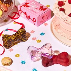 a table topped with lots of cakes and desserts