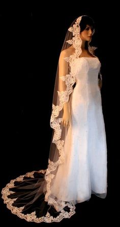 a mannequin wearing a wedding dress and veil