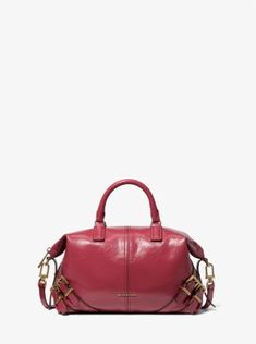 The epitome of downtown cool, our Darrington satchel is softly structured in crushed leather with buckle-fastening details that will punctuate any look. Its fully-lined interior features a slip pocket to keep just the essentials neatly organized. Adjust the crossbody strap to your desired length. Leather Satchel, Crossbody Strap, Deep Red, Antique Gold, Top Handle, Satchel, Dust Bag, Women Handbags, Michael Kors