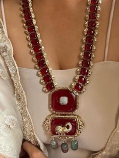 Sparkly Ruby  Doublet Victorian CZ Gold Plated Long Necklace with AAA quality CZ stones and fine Kundan. Real Ruby  Doublet stone used This necklace comes with Earrings as well Necklace Length - 21 inches +Adjutable Dori  Earrings Length- 3 inches aproxx This Long Necklace has global appeal and represents elements of Indian, Pakistani as well as Punjabi Jewelry 18 K Victorian Gold  plated Earrings Closure: Pushback Necklace has extended Dori for adjustability Highest quality and craftsmanship This set will surely make heads turn .. Finest Kundan work . Customized orders takes 3 to 4 weeks, depending on piece requirements. The Ombre Designs Jewelry pieces can be customized in accordance with your requirement. Please Email or Whats app on : +91 8448833193 / sonalikamehra@ theombredesigns.com Festive Formal Bridal Sets With Stone Work, Elegant Heavy Traditional Wear For Reception, Traditional Formal Jewelry With Zari Work, Festive Diamond Bridal Necklace For Ceremonial Occasions, Temple Jewelry For Wedding And Reception With Stone Work, Festive Ruby Bridal Necklace For Wedding, Festive Ruby Bridal Necklace, Luxury Ceremonial Bridal Necklace For Festive Season, Elegant Ceremonial Traditional Wear With Stone Work