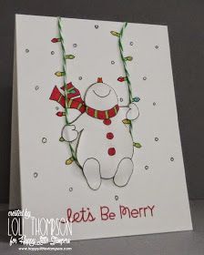 a white card with a snowman holding a red and green christmas decoration on it