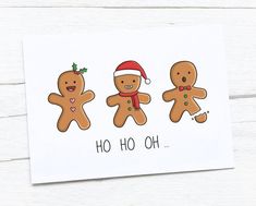 three gingerbreads with santa hats on and the words ho hoo oh