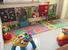 a child's play room with toys on the floor