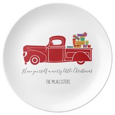 a plate with an old red truck and presents on it