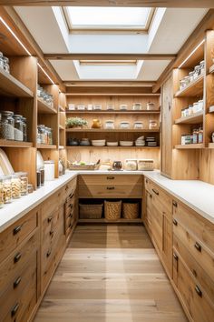 a kitchen with lots of wooden cabinets and shelves filled with food on top of them