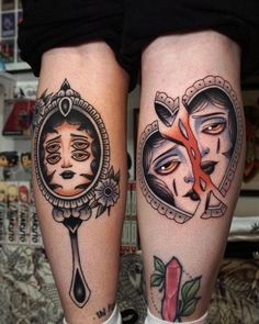 two people with tattoos on their legs, one has scissors and the other has an eye